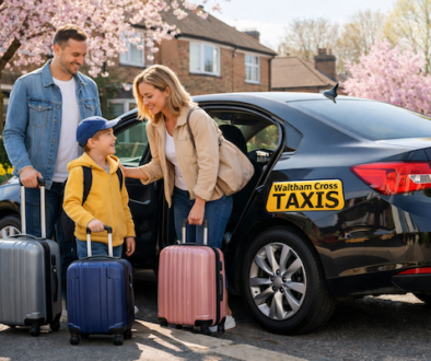 Modern black taxi picking up a family for Easter 2025 travel in Waltham Cross.
